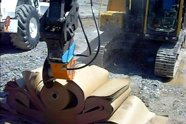 Cutting paper at a paper recycling depot using Echidna diamond rocksaw fitted with a woodcutting blade.